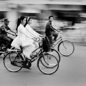 Saigon's motorbike craze is one of the heralds of the Vietnam's cultural and economic rejuvenation.

The morning commute finds young schoolgirls dressed in the traditional Ao Dai. Pre-communist fashions have made a big comeback since the late 1980s when the government began to loosen restrictions.